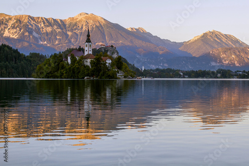 Beautiful mountain lake Bled . Pilgrimage Church of the Assumption of Maria situated on an island . Mountains in background. Slovenia, Europe. European travel.