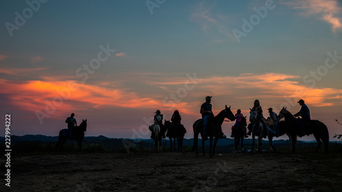 Horse Riders at Sunset