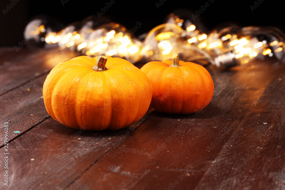 Diverse assortment of pumpkins on rustic table. Autumn harvest
