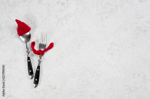 White winter textured background with funny cutlery