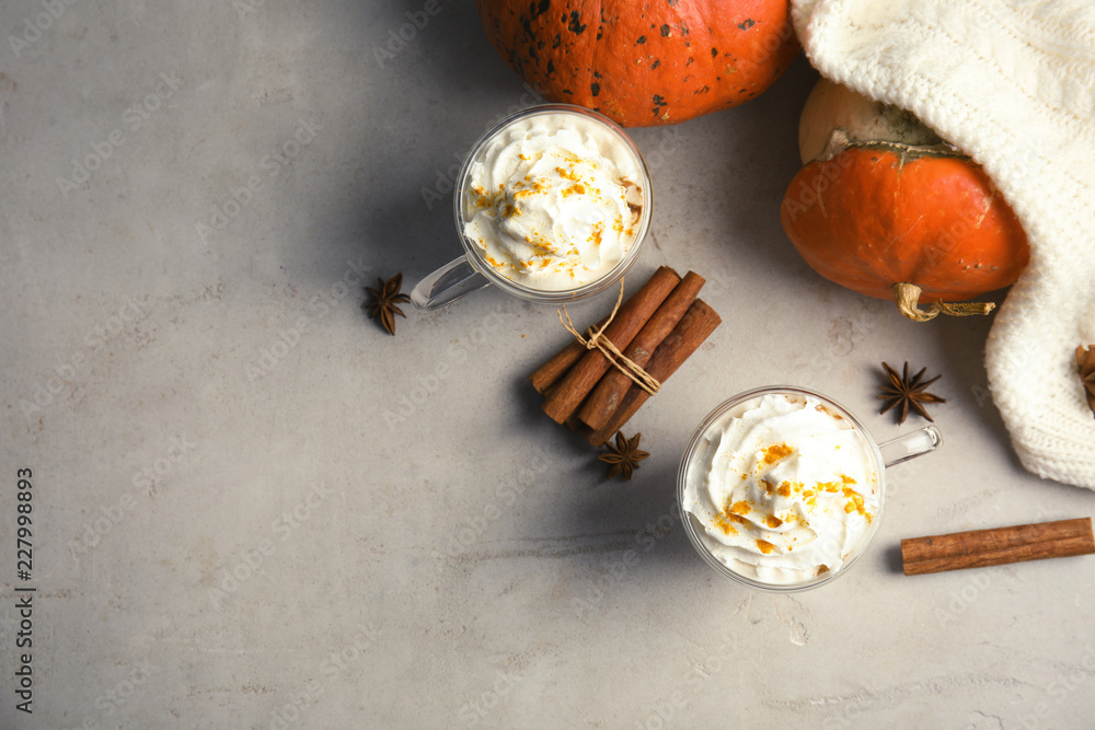 Flat lay composition with pumpkin spice latte and space for text on table