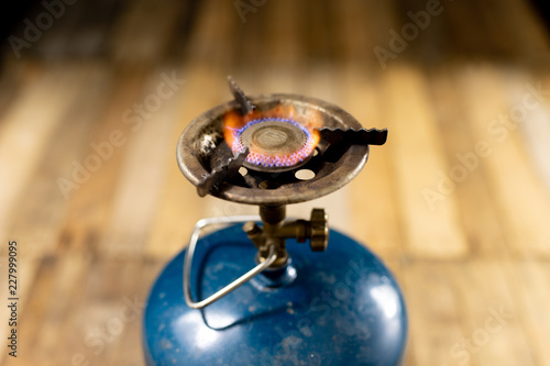 Flame of a tourist gas burner. Accessories for preparing food outdoors.