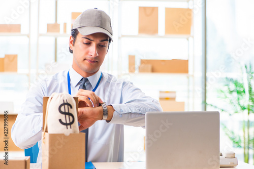 Male employee working in box delivery relocation service