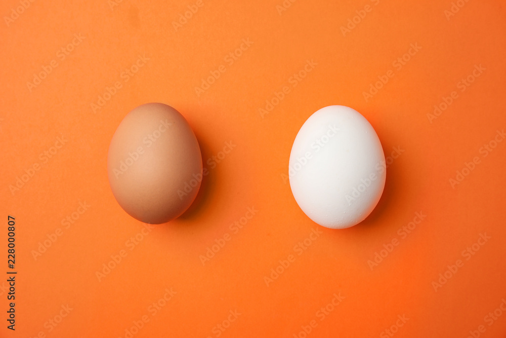 Raw chicken eggs on color background, top view Raw chicken eggs on color background, top view