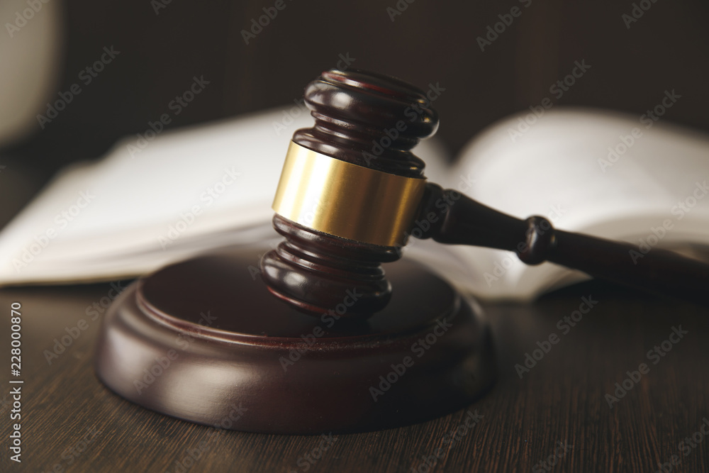 Judge gavel, scales of justice and law books in court Judge gavel, scales of justice and law books in court