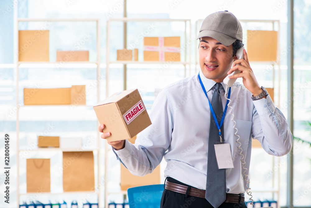 Male employee working in box delivery relocation service Male employee working in box delivery relocation service