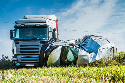 Car accident on a road in September, car after a collision with a heavy truck