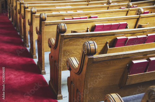Fotografie Old wooden church pews. Close-up