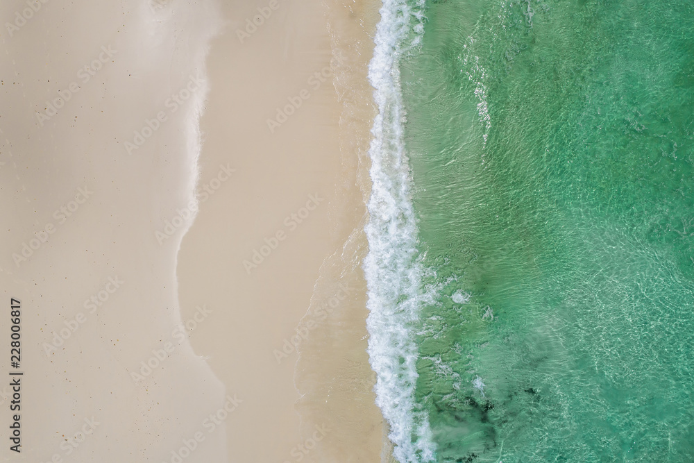Beautiful tropical white empty beach and sea waves seen from above. Seychelles beach aerial view Beautiful tropical white empty beach and sea waves seen from above. Seychelles beach aerial view