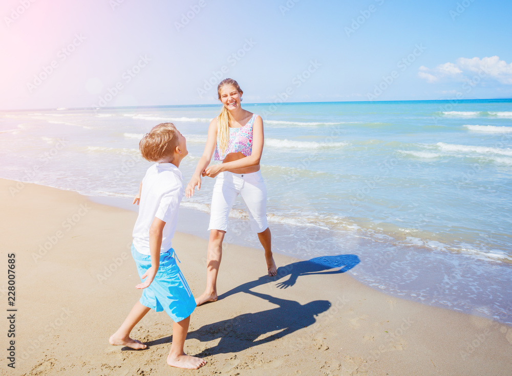 Adorable kids have fun on the beach.