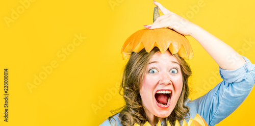 Portrait of beautiful cheerful woman with pumpkin Thanksgiving day 