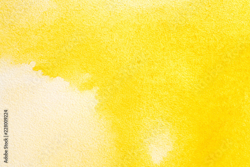 watercolor paper background yellow paint. water spread