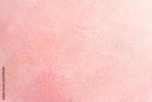 watercolor paper background with red pink paint. water spread