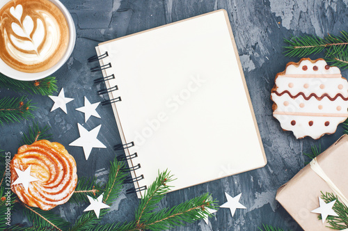 Christmas background with notepad and cuo of cappuccino.