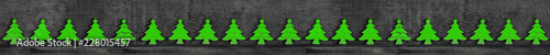 Christmas decoration wooden background with row of small wooden fir trees seamless banner photo