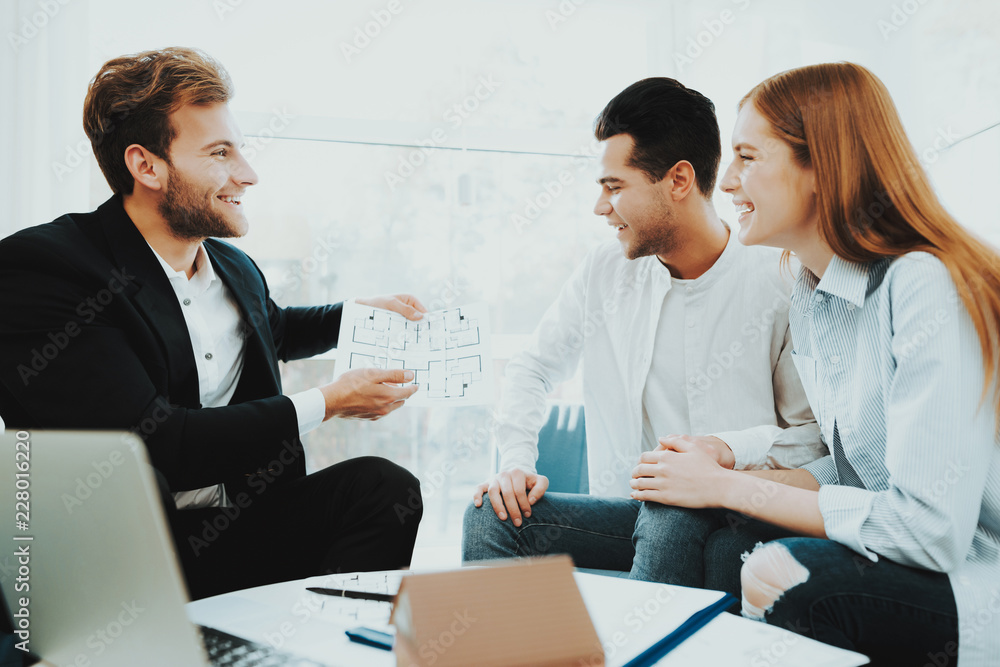 Young Couple Meeting With Rieltor. Bright Office. Young Couple Meeting With Rieltor. Bright Office.
