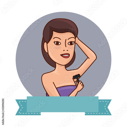woman in towel waxing armpit with razor blade