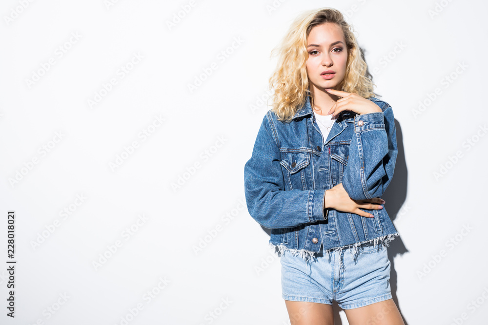 Cool smiling girl in jeans jacket isolated on white background Cool smiling girl in jeans jacket isolated on white background