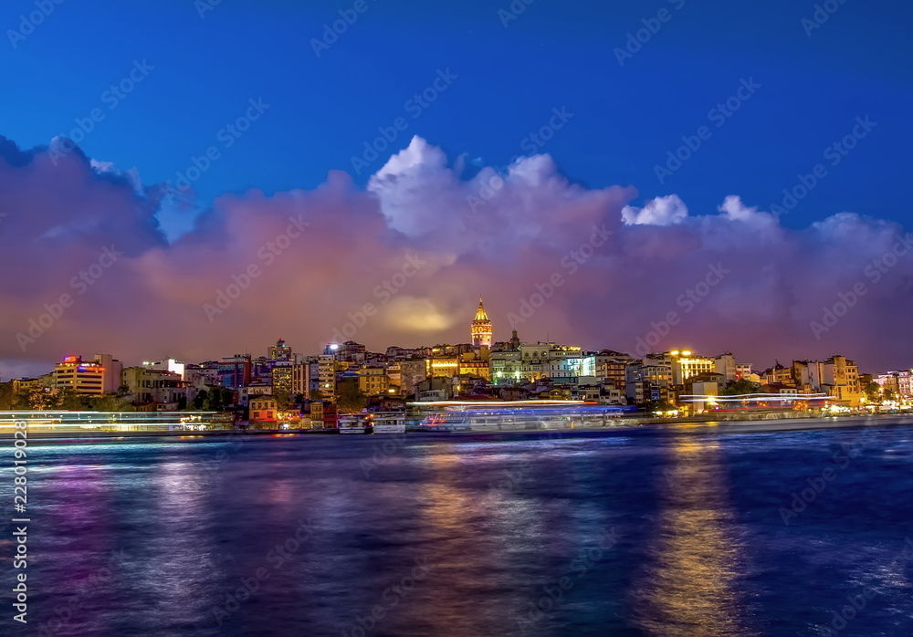Touristic landmarks from sea voyage on Bosphorus. Cityscape of Istanbul at sunset - old mosque and turkish steamboats, view on Golden Horn.