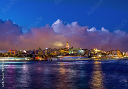Touristic landmarks from sea voyage on Bosphorus. Cityscape of Istanbul at sunset - old mosque and turkish steamboats, view on Golden Horn. © blackdiamond67