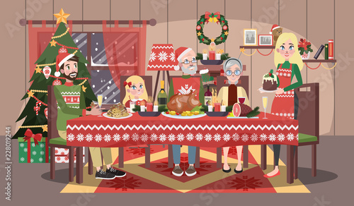 Happy family sitting at the christmas table.