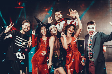 Portrait of Young Smiling People in Scary Costumes