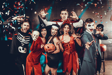 Portrait of Young Smiling People in Scary Costumes