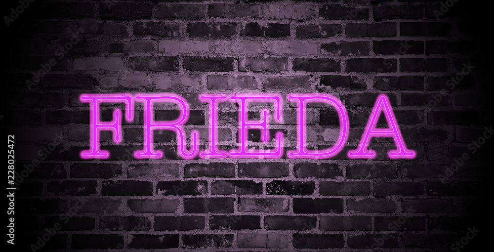 Fototapeta premium first name Frieda in pink neon on brick wall