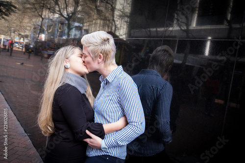 twenty something lesbian couple embrace