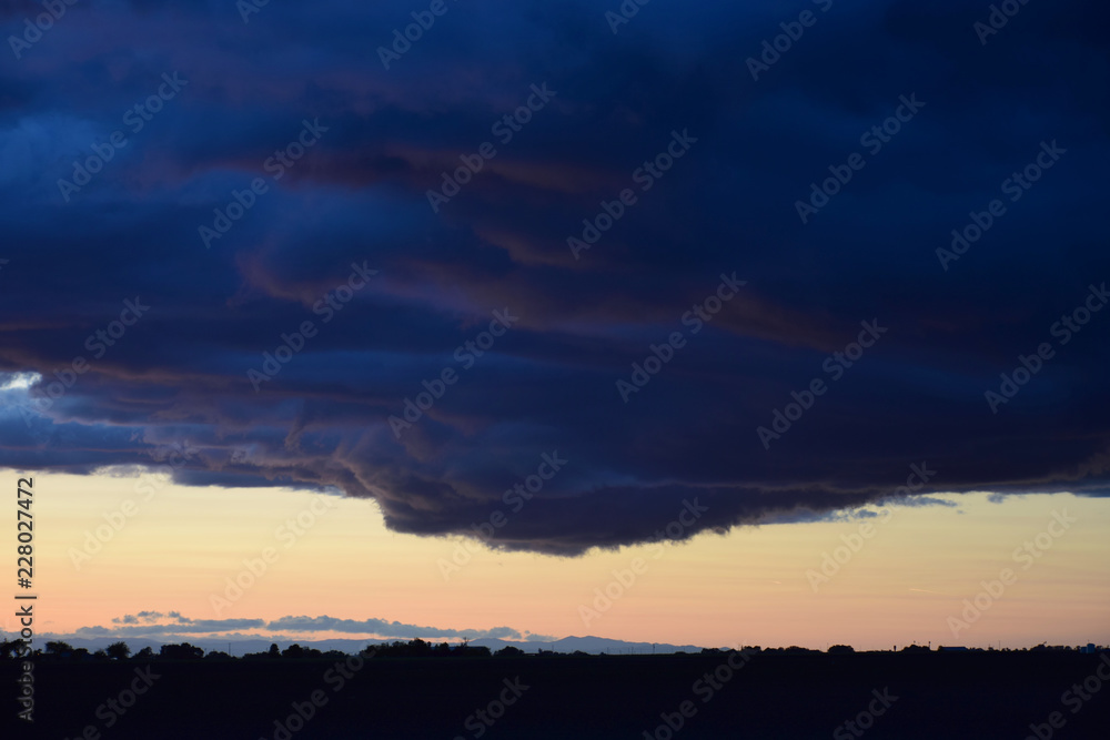Fototapeta premium Dark cloud at dusk