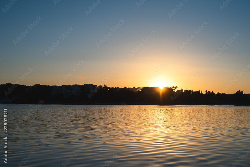 The reflection of the sunset in the lake. Background for design.
