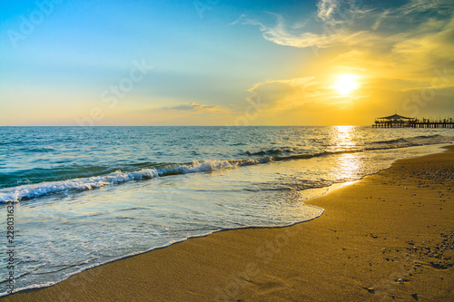 Fototapeta Naklejka Na Ścianę i Meble -  Golden Sunset on the beach