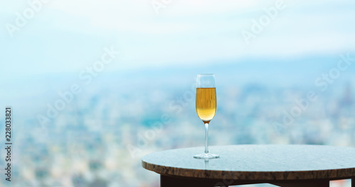 White wine on a table high above the city
