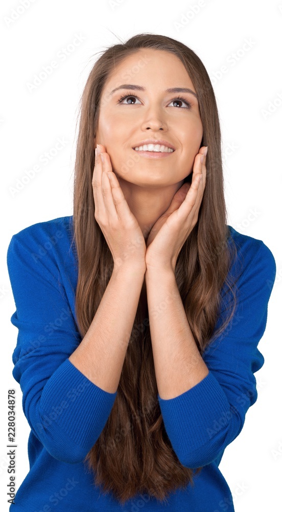 Fototapeta premium Young Woman Smiling and Standing with Hands on Face - Isolated