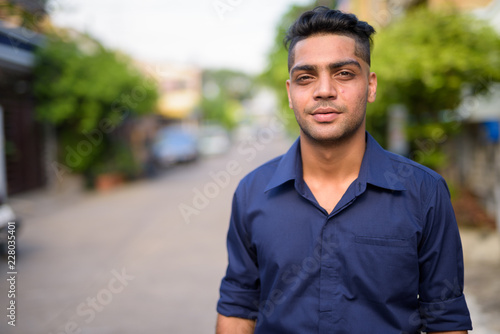 Young Indian businessman in the streets outdoors