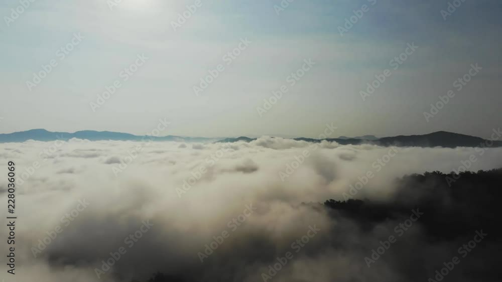 Landscape of Morning Mist with Mountain Layer at north of Thailand. Aerial View. Flying over the high mountains in beautiful clouds . Aerial camera shot. Landscape of Morning Mist with Mountain Layer at north of Thailand. Aerial View. Flying over the high mountains in beautiful clouds . Aerial camera shot.