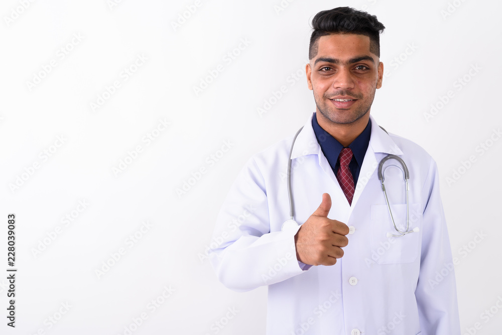 Young Indian man doctor against white background Young Indian man doctor against white background