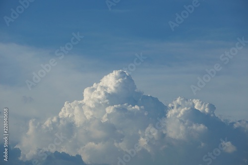 Amazing cumulus clouds and sunlight on the background of clear blue sky, Summer in GA USA.