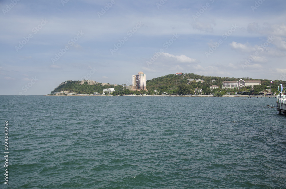 View landscape and seascape of andaman sea at Bangsan beach with view Khao Sam Muk mountain background in Chonburi, Thailand