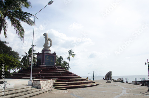 Sculpture of dolphins on the waves monument in Laem Thaen Cape at Bang Saen Beach in Chonburi, Thailand photo