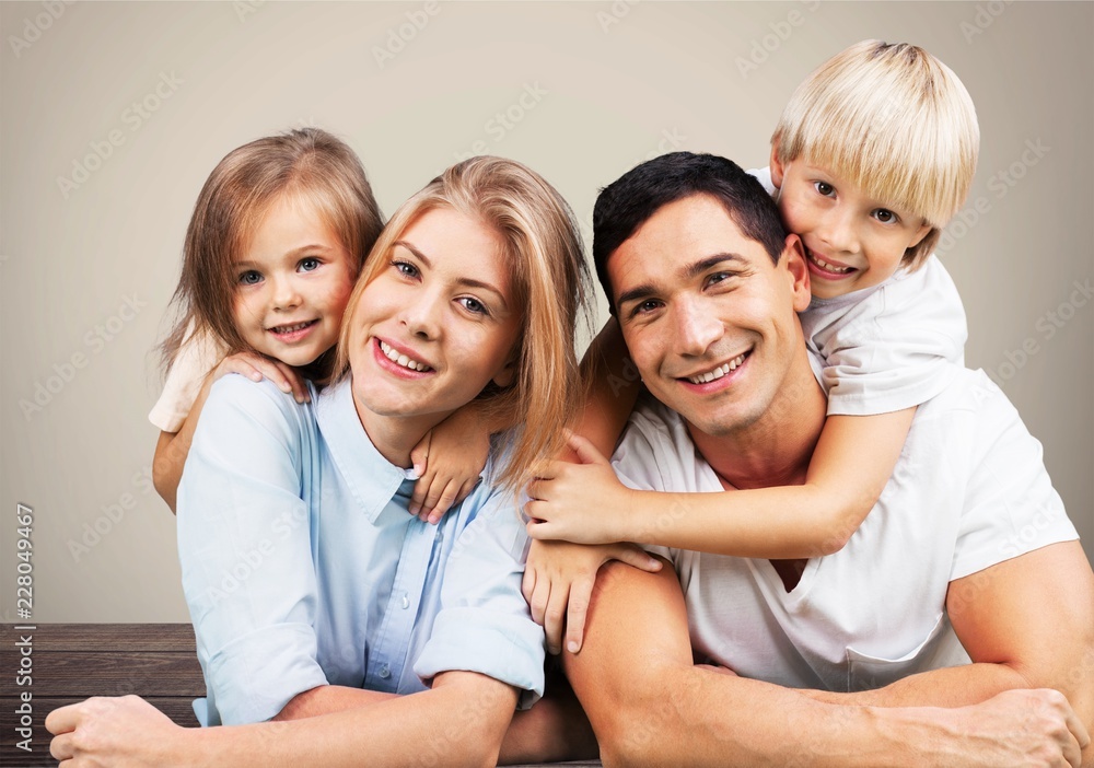 Beautiful smiling Lovely family on background Beautiful smiling Lovely family on background