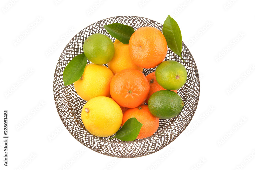 Citrus fruits in basket, isolated on white background. Lemon, orange, lime. Citrus fruits in basket, isolated on white background. Lemon, orange, lime.