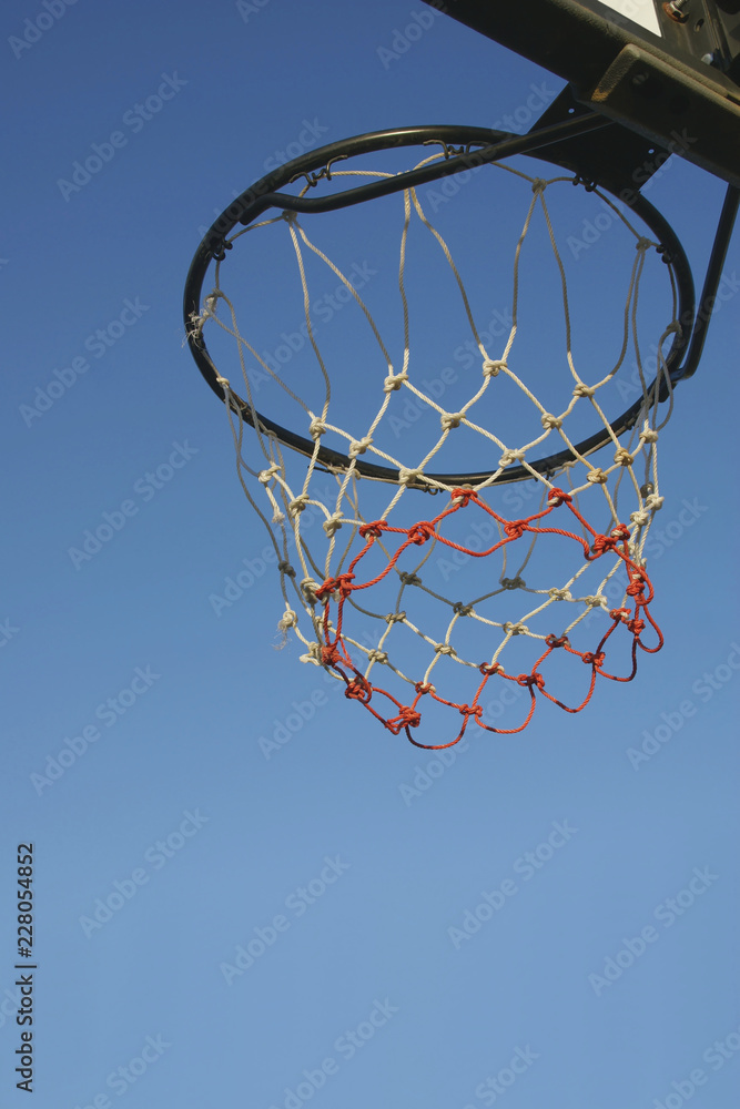 Basketball Hoop with Clear Blue Sky Background