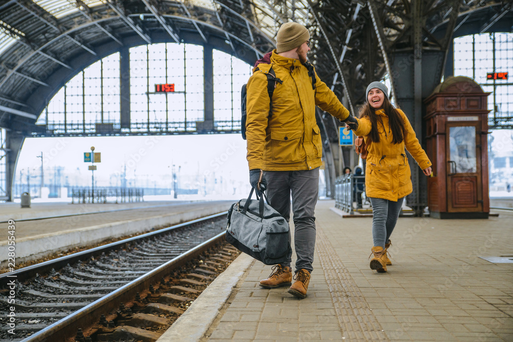 man pull woman to get in time for train man pull woman to get in time for train