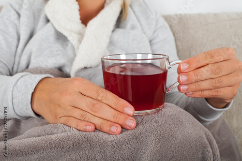 Close up woman holding hot tea