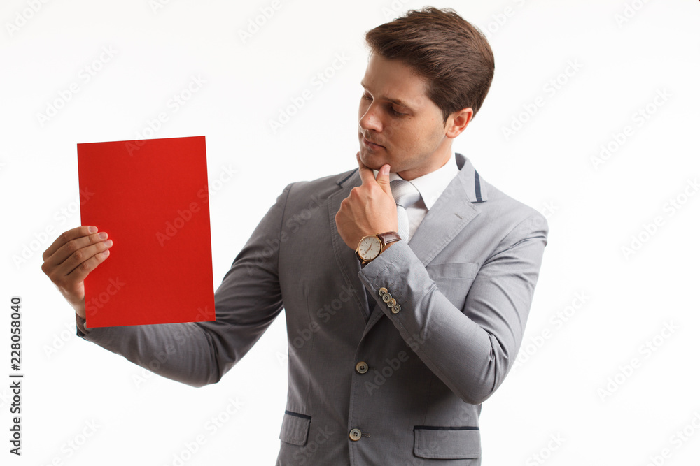 Businessman showing signboard. In studio on a white background Businessman showing signboard. In studio on a white background