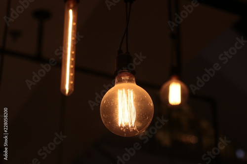A electric lamp lighting . modern and vintage style , interior ceiling hanging light bulb decorate at room © Rattanachai