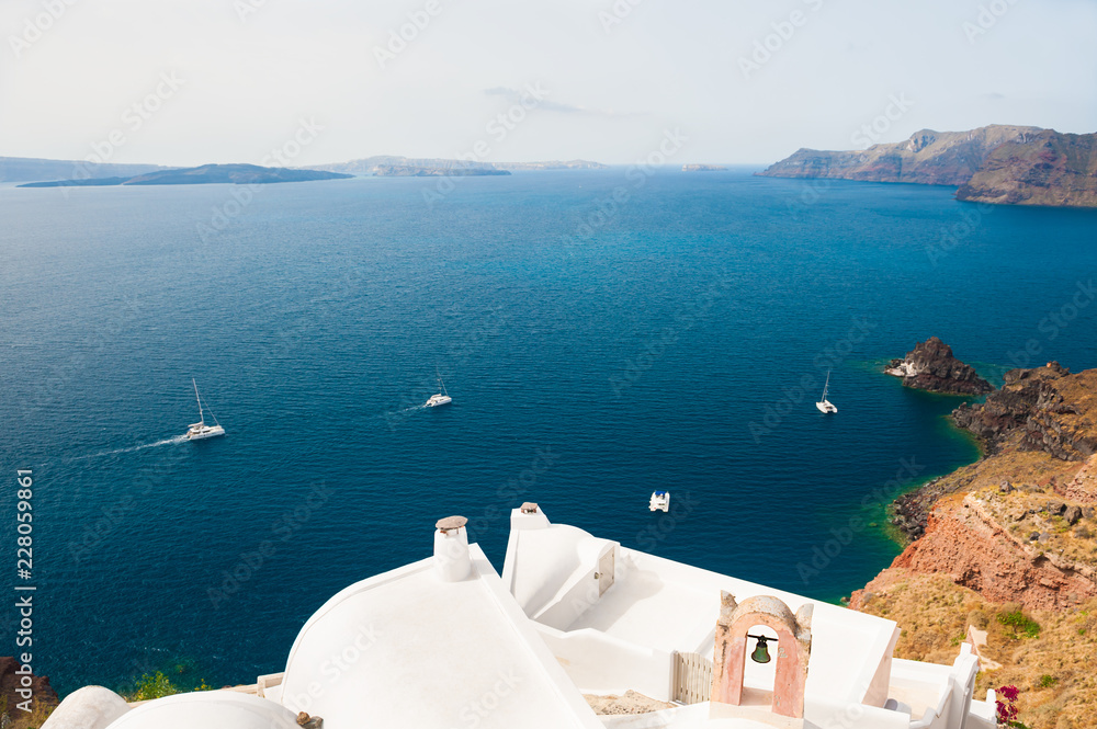 Fototapeta White architecture on Santorini island, Greece. Beautiful summer landscape, sea view.