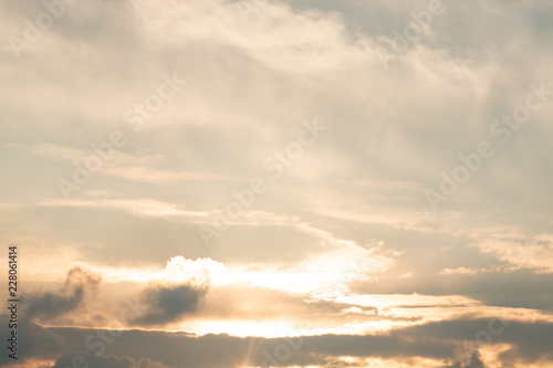 blue and gold sky background with white cloudy , twilight in the evening .