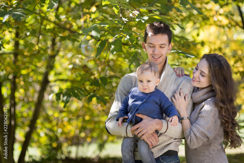 family with a baby in autumn park